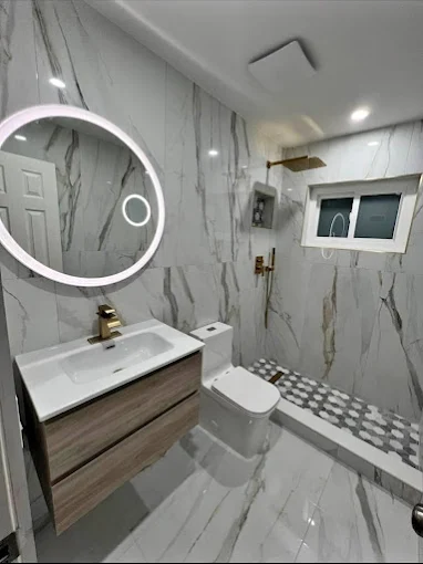 Art Lego LLC bathroom remodel with glass shower enclosure — South Florida