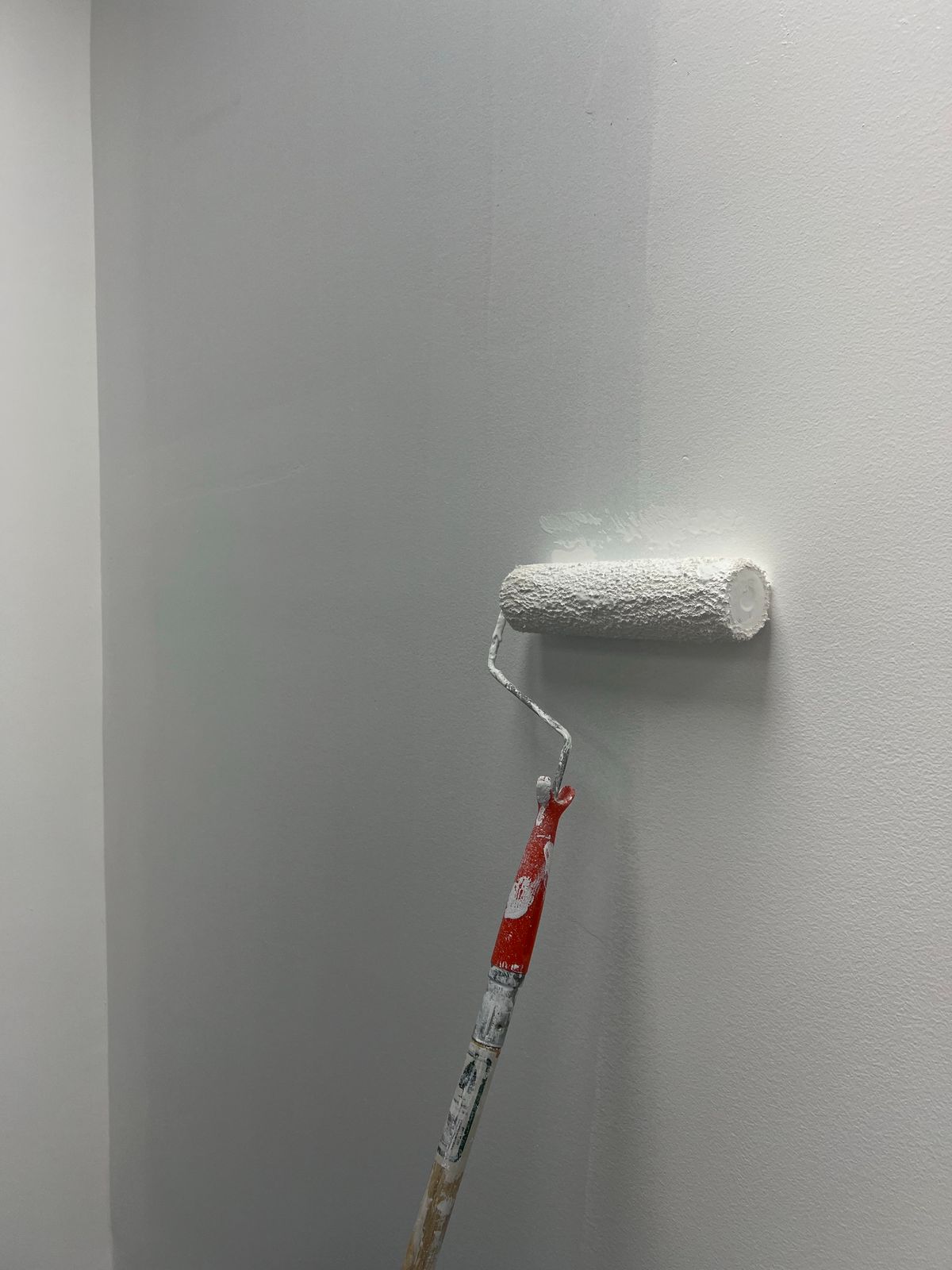 Interior painting with roller and white paint by Art Lego LLC